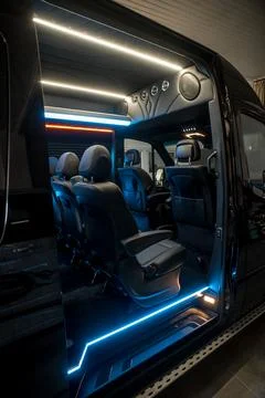 Comfortable interior of a passenger bus with soft seats Stock Photos