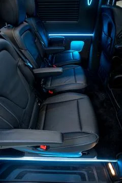 Comfortable interior of a passenger bus with soft seats Stock Photos