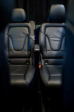 Comfortable interior of a passenger bus with soft seats Stock Photos