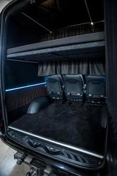 Comfortable interior of a passenger bus with soft seats Stock Photos