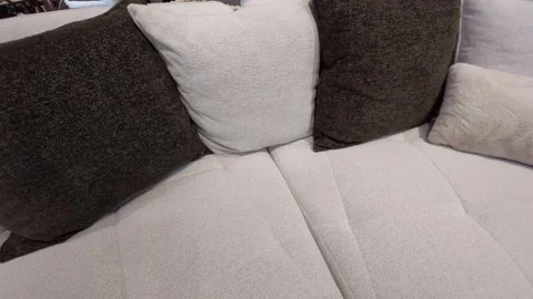 Comfortable modern sofa with plush decorative cushions and pillows Stock Footage 345431414