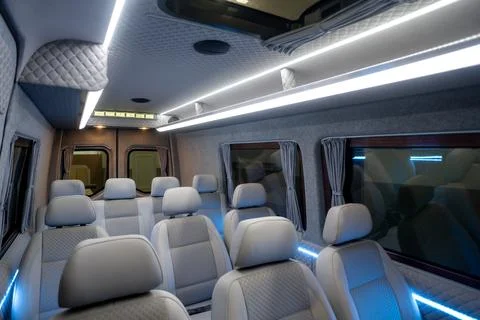 Comfortable passenger bus interior with upholstered seats Stock-Fotos