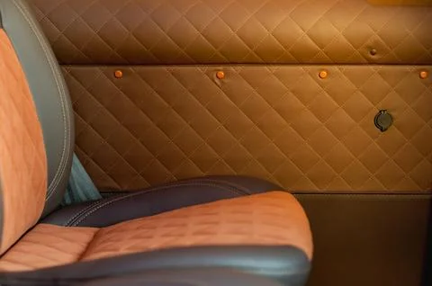 Comfortable passenger bus interior with upholstered seats Stock Photos
