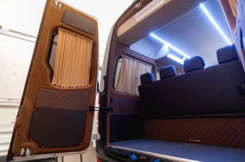 Comfortable passenger bus interior with upholstered seats Stock Photos