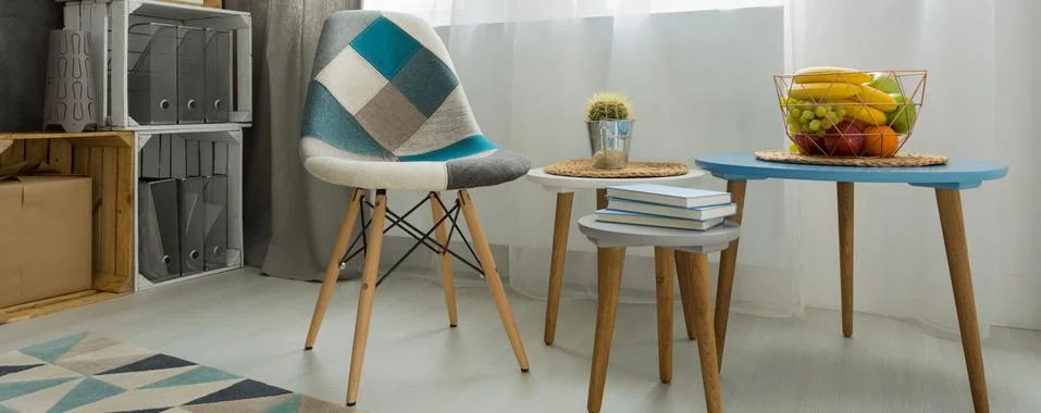 Comfortable patchwork chair inviting to have a seat Stock Photos