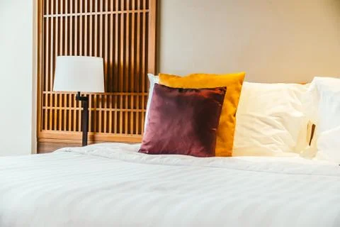 Comfortable pillow on bed Stock Photos