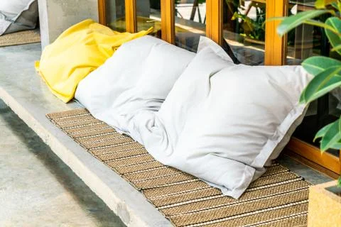Comfortable pillow on sofa Stock Photos