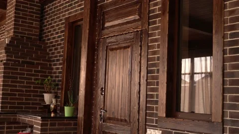Comfortable room with doors and windows from wood and fireplace in 4K Stock Footage 120730790