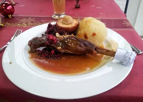 Comfortable Rustic Setting Featuring Flavorful Roasted Pork Alongside Vibra.. Stock Photos