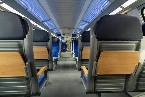 Comfortable seating inside German train carriage. Modern passenger transpor.. Stock Photos