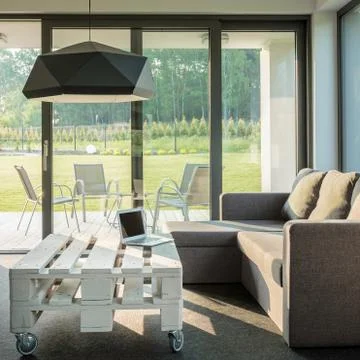 Comfortable sofa and stylish table Stock Photos