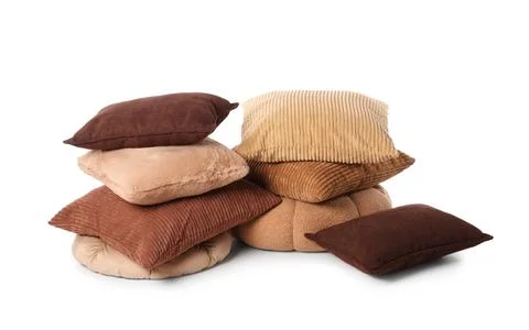 Comfortable stack of assorted brown and beige pillows for home decor and inte Stock Photos