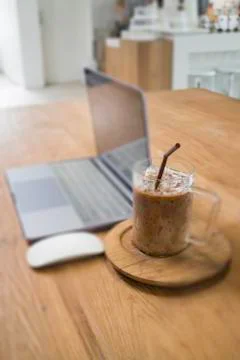 Comfortable work desk with notebook laptop Stock Photos