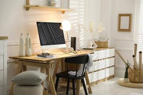 Comfortable workplace with computer in home office Stock Photos