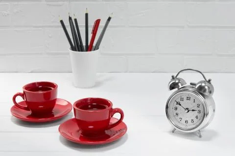 Comfortable workplace office - work table with two red coffee or tea mugs - o Stock Photos