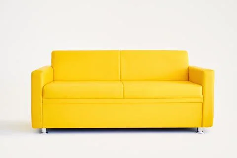 Comfortable yellow sofa on white background Stock Photos