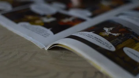 Comic book reading. young caucasian man read comix comic book. Stock Footage 248685416