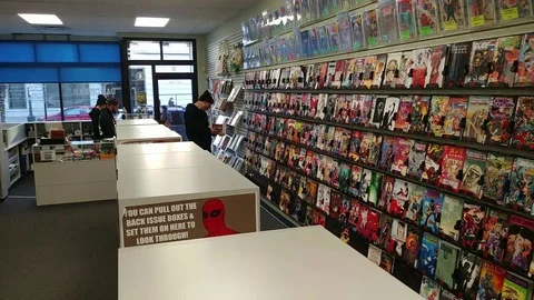 Comic Book Store - Interior - Pan - Graphic novel Stock Footage 100697936