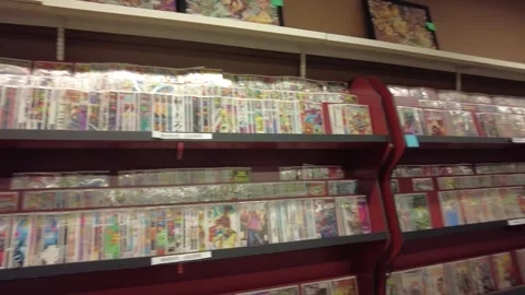 Comic Book Store Left To Right Pan Of Display Stock Footage 246321049
