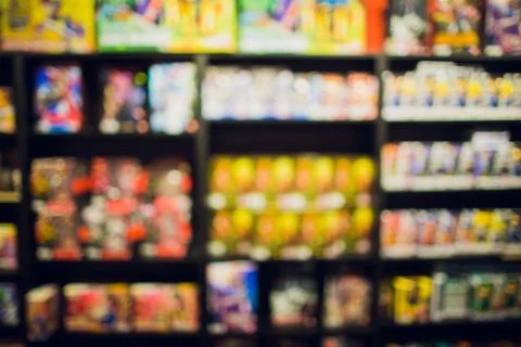 Comic books in bookshelf for background store. Stock Photos