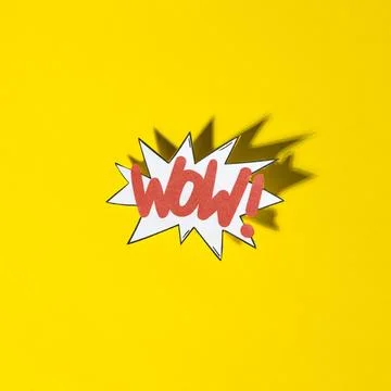 Comic boom bubble with expression text wow with shadow yellow background Stockfoto's