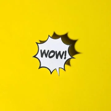 Comic cartoon speech bubble wow emotions yellow backdrop. High quality pho... Stock Photos