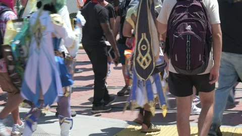 Comic-Con attendees walking (no faces) - bags, people, feet, costumes Stock Footage 246634552