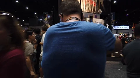 Comic Con SDCC 2019 - Convention Floor Jib Crane Up through crowd of people Stock Footage 112942601