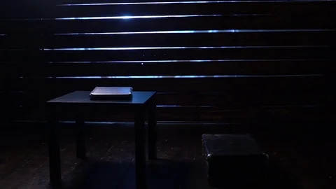 Comic funny hacker commits a cyber attack with a laptop and a gun in his hands Video stock 82552225