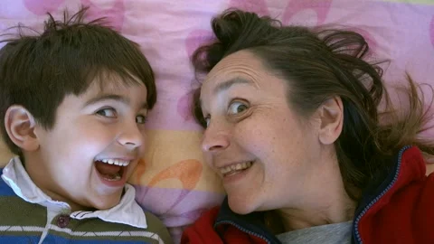 Comic mother and child look at each other and monkey on camera 스톡 동영상 148388684