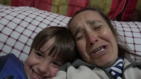Comic mother cries and scolds her smiling child Stock Footage 100172874
