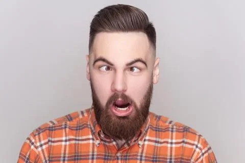 Comic positive bearded man looking cross-eyed, having fun with silly face Stock Photos