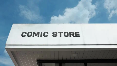 Comic store word sign displayed on building with blue sky background Stock Footage 318572791