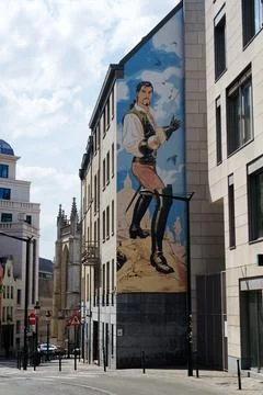 Comic strip murals on facade on public street on May 25, 2025 in Brussels, .. Stock Photos