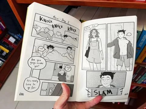 Comic style book page open showing black and white illustrated story Stock Photos