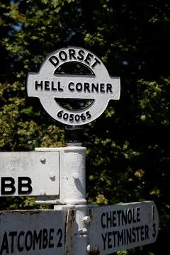 The comical and old-fashioned signpost at Hell Corner in Dorset England Stock Photos