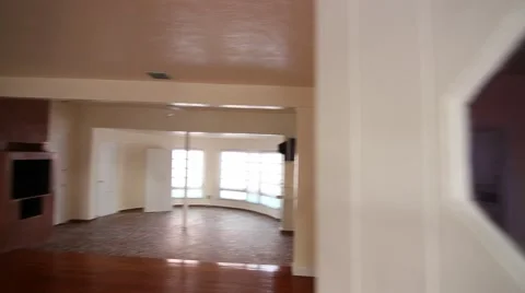 Coming into empty house with white wall and wood floors Stock Footage 45523834