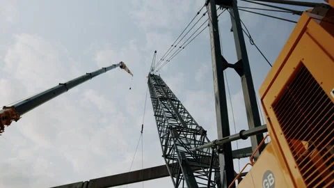 Coming Into Focus Two Construction Site Cranes 4K 48FPS SLO-MO Stock Footage 265701329