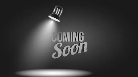 Coming soon message illuminated with light projector loop Stock Footage 38210727