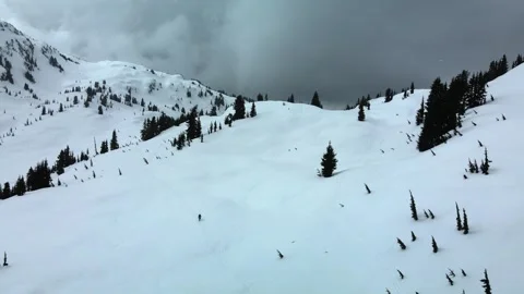 In coming Storm Cloud in the Mountains, snow alpine, Aerial View Stock Footage 289575153