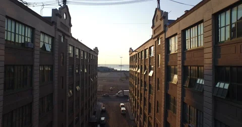 Coming Up through Brick Buildings to the Sunset Vídeos de archivo 58021763