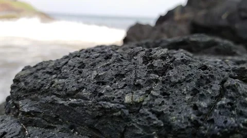 Coming waves black rocks Video stock 154024335