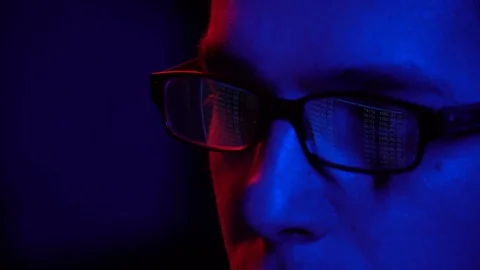 Command line display in the eye. programmer at the computer. display in glasses Stock Footage 124360805