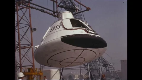 Command module suspended from crane hook during drop test - 1965 Stockbeeldmateriaal 102182538
