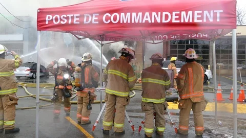 Command post at fire incident with tent with french words Stock Footage 127257182