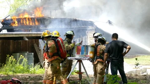 Command post of a fully involved house fire in clearing Stock Footage 94863028