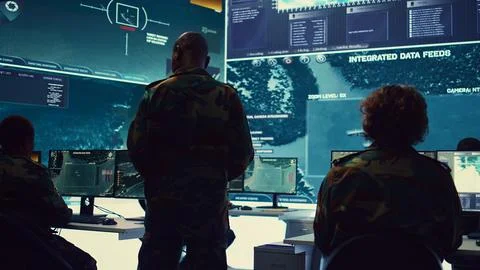 Commander and his crew operating radar systems via CCTV and satellite Stock Photos