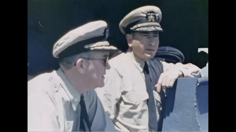 Commander John Ford interact with officer and sign clipboard - 1957 Stock Footage 103179866