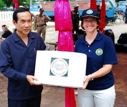 Commander of Pacific Partnership 2010, Capt. Lisa M. Franchetti, holds a bo.. Stock Photos