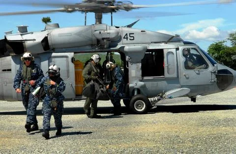 Commander of the Pacific Partnership, Capt. Lisa Franchetti, disembarks an .. Stock Photos